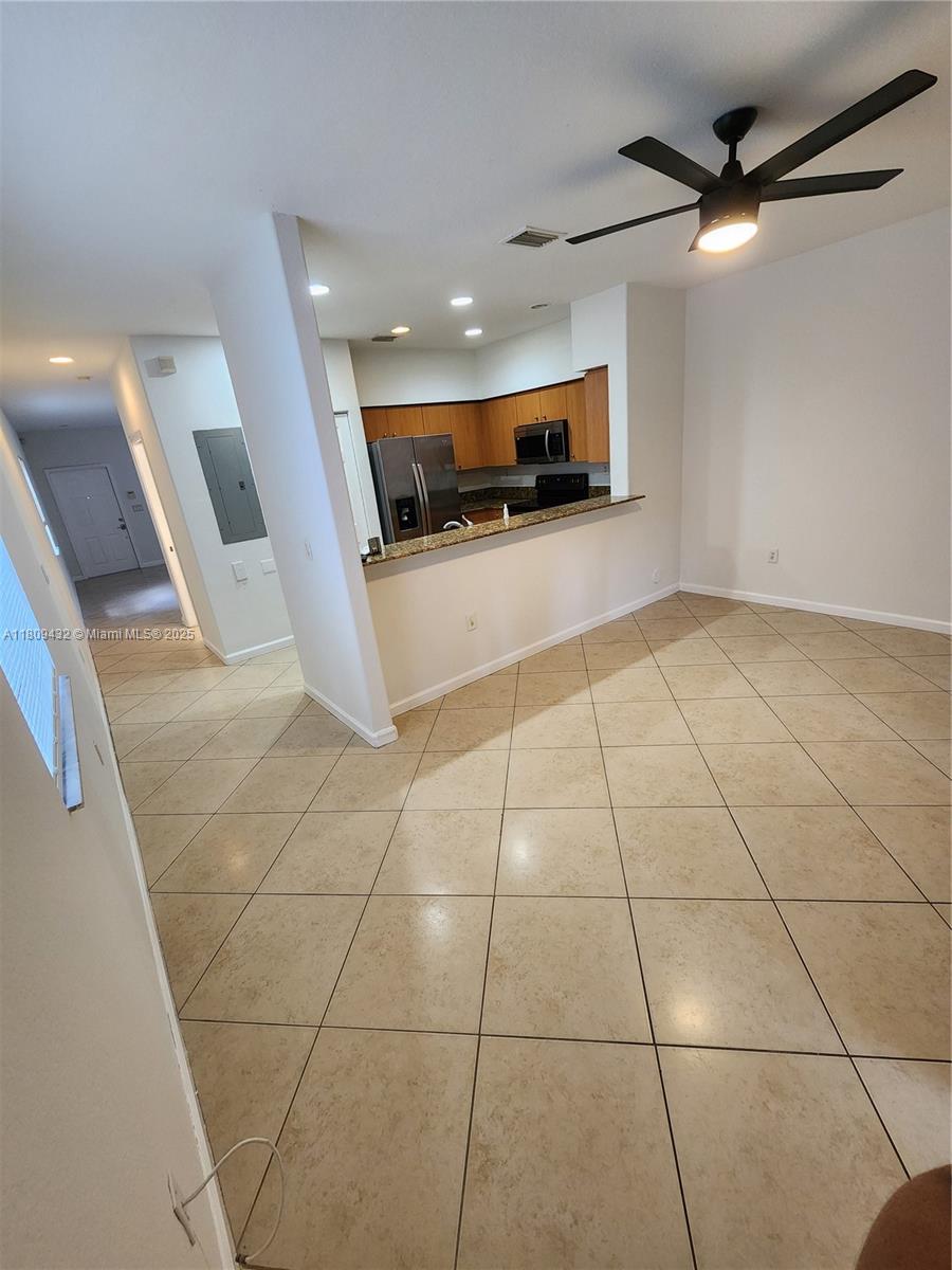 Miramar Miramar, FL 33025 - Photo 5 of 37 a view of an empty room with kitchen view
