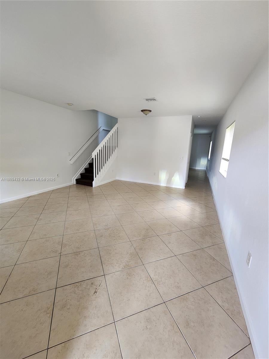 Miramar Miramar, FL 33025 - Photo 7 of 37 a view of an empty room with a window