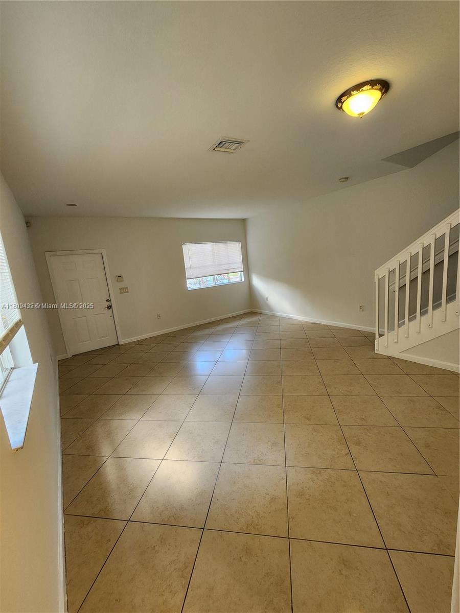 Miramar Miramar, FL 33025 - Photo 8 of 37 a view of a livingroom with wooden floor and a bathroom