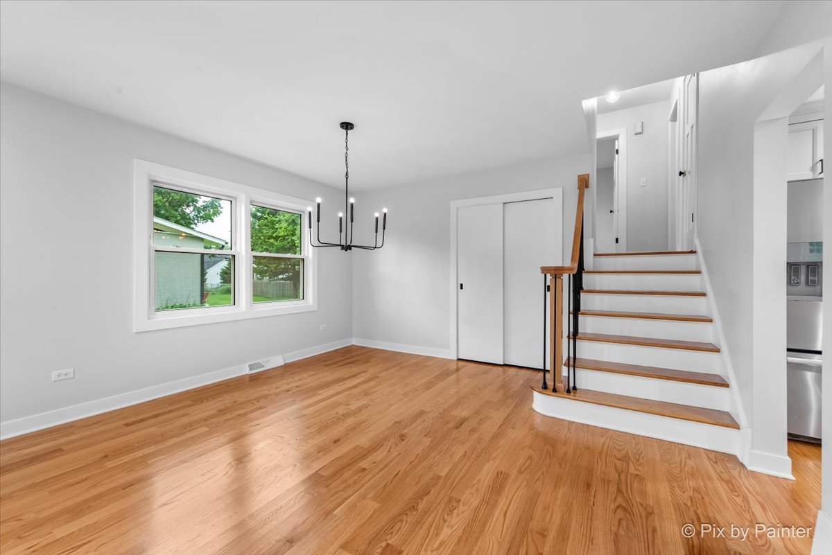 918 Delles Road Wheaton, IL 60189 - Photo 16 of 36 a view of empty room with wooden floor and window