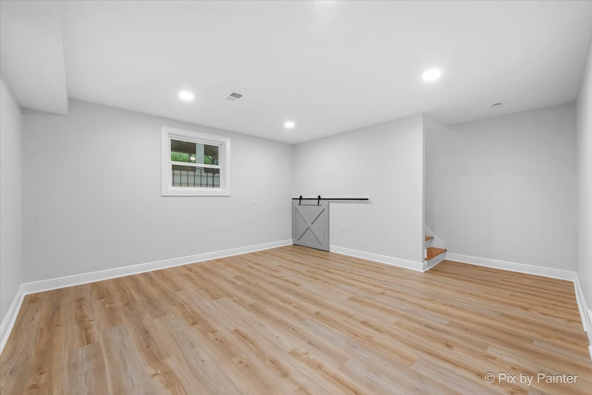 918 Delles Road Wheaton, IL 60189 - Photo 21 of 36 a view of empty room with wooden floor and fan