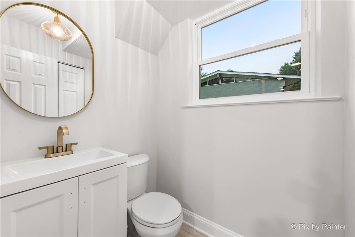 918 Delles Road Wheaton, IL 60189 - Photo 28 of 36 a bathroom with a sink mirror vanity and toilet