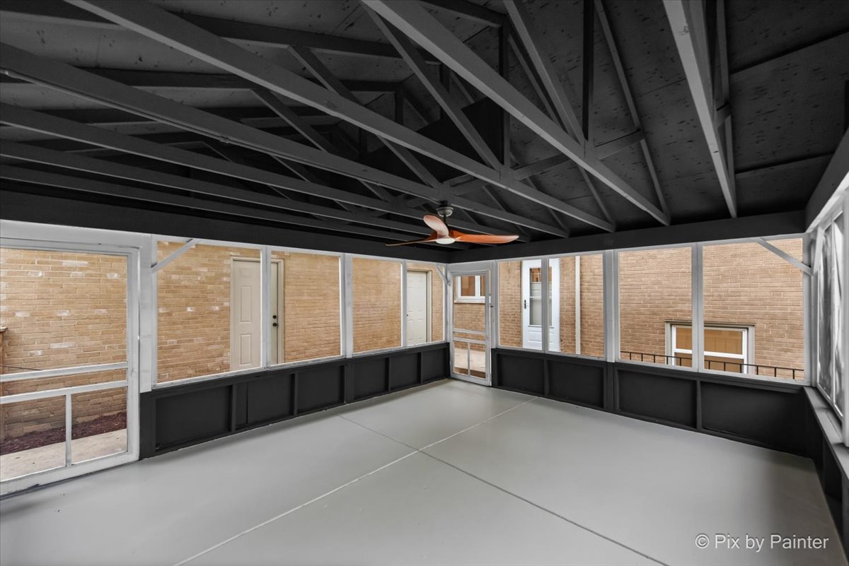 918 Delles Road Wheaton, IL 60189 - Photo 29 of 36 a large room with wooden floor and windows