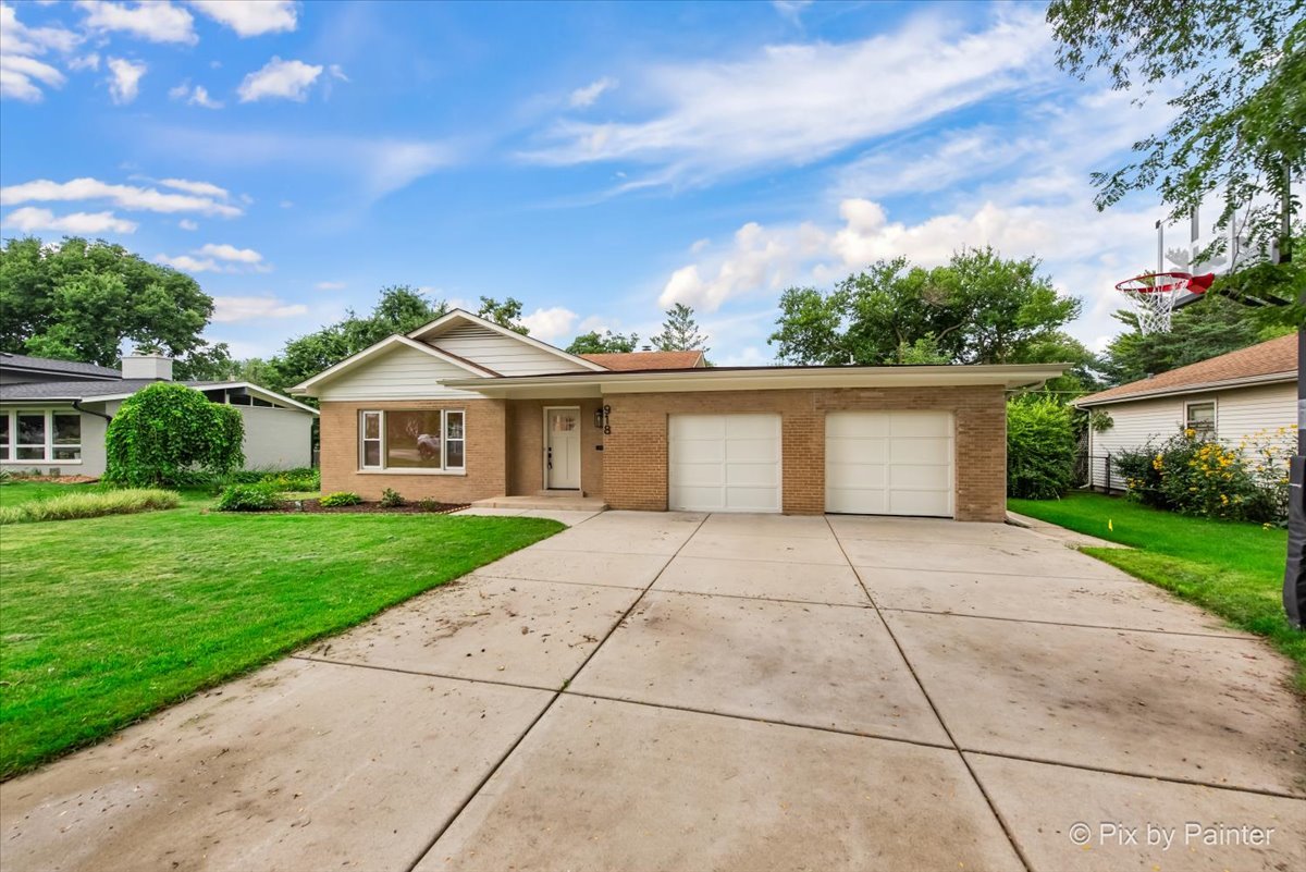 918 Delles Road Wheaton, IL 60189 - Photo 31 of 36 a view of house and outdoor space with yard