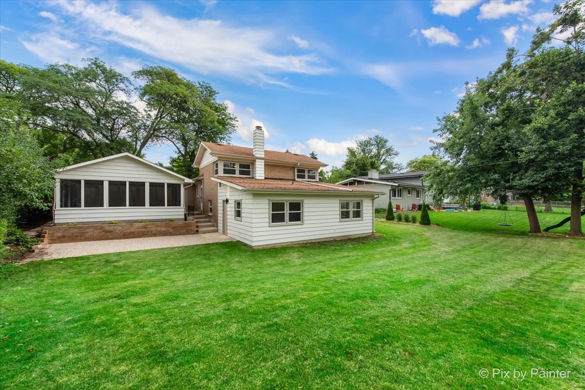 918 Delles Road Wheaton, IL 60189 - Photo 35 of 36 a front view of a house with a garden