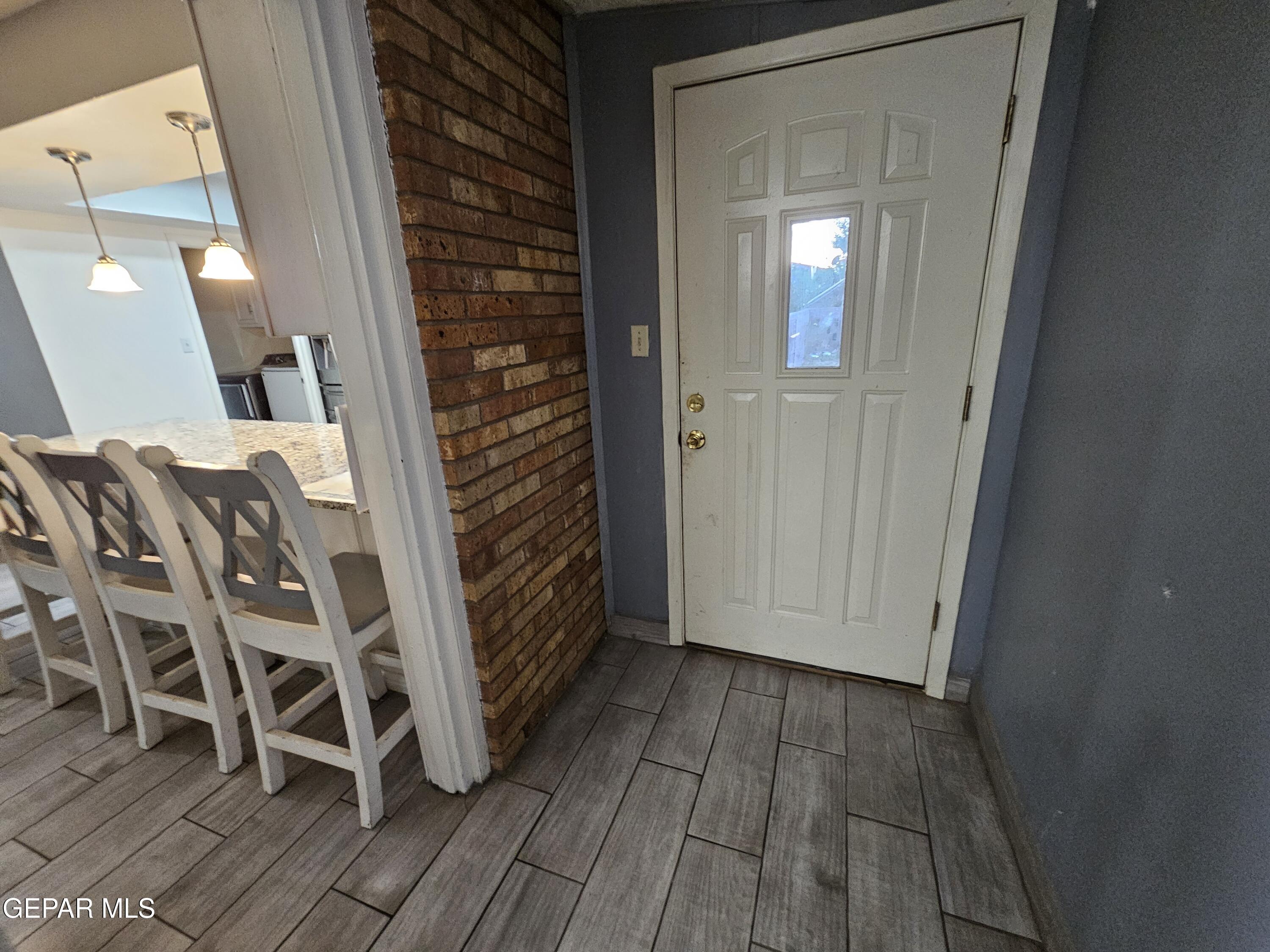 1400 San Andres Drive Las Cruces, NM 88007 - Photo 14 of 47 a view of a hallway with wooden floor and staircase