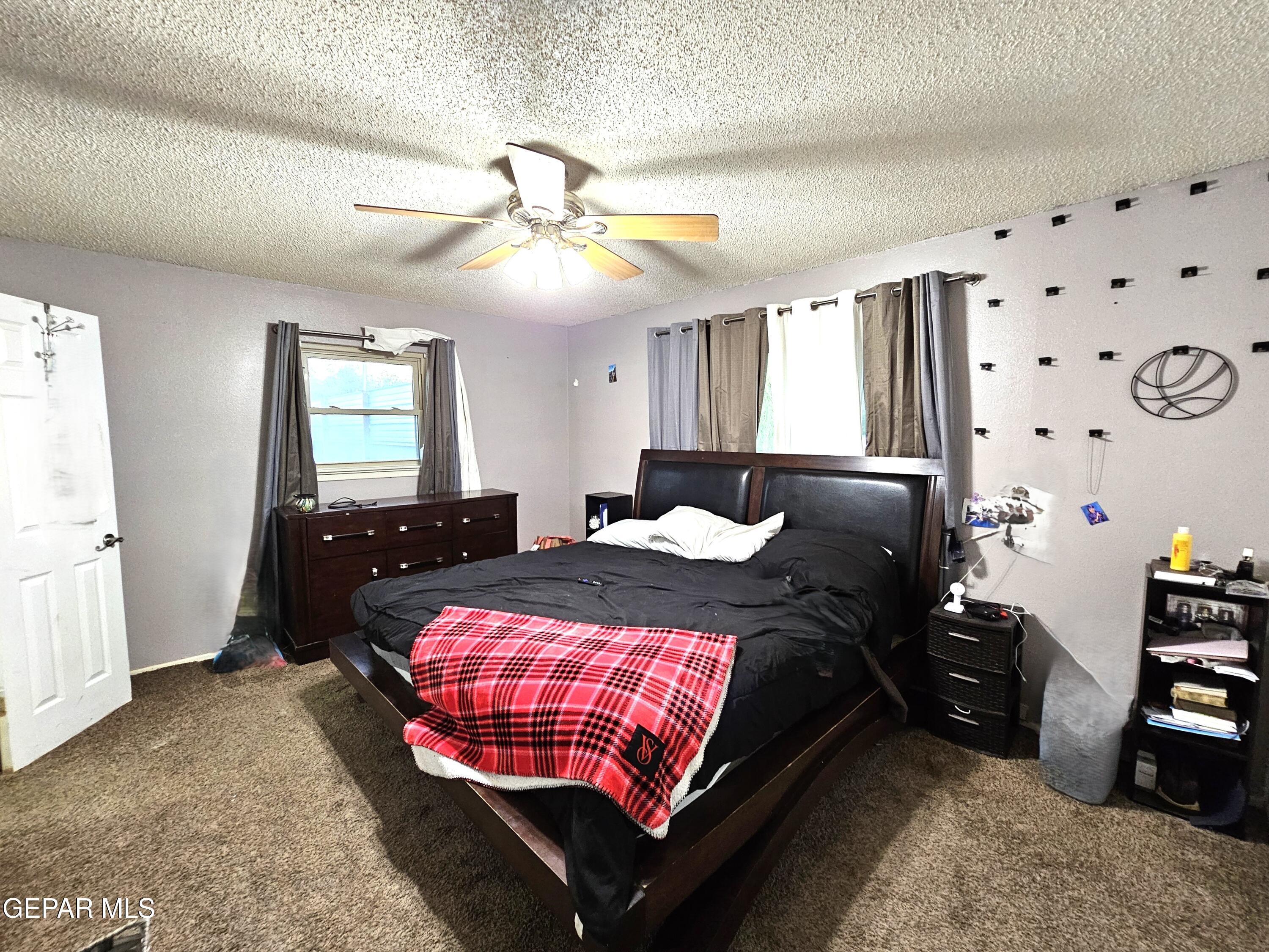 1400 San Andres Drive Las Cruces, NM 88007 - Photo 20 of 47 a bed room with a bed window and dresser