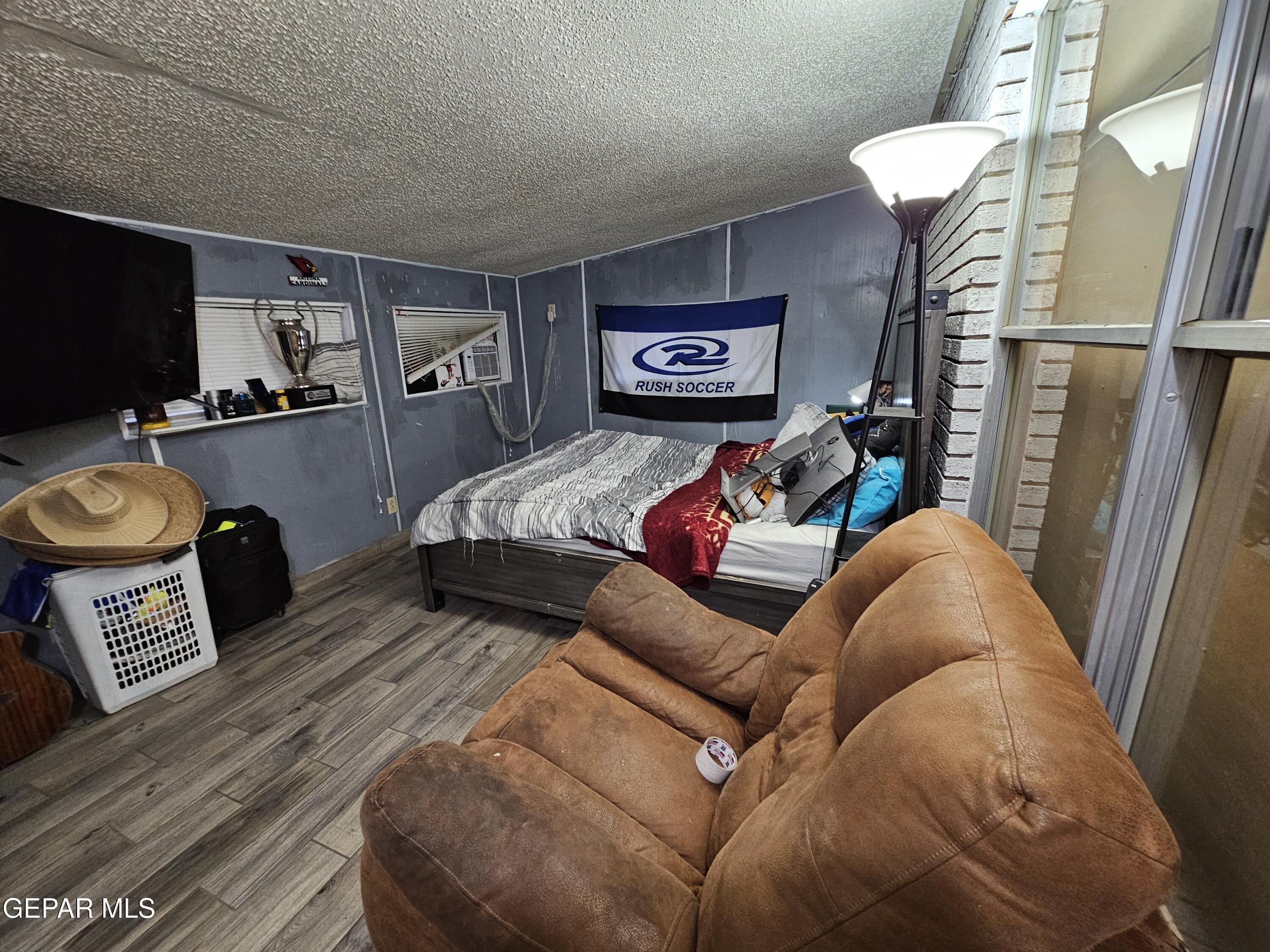 1400 San Andres Drive Las Cruces, NM 88007 - Photo 30 of 47 a living room with furniture and a flat screen tv