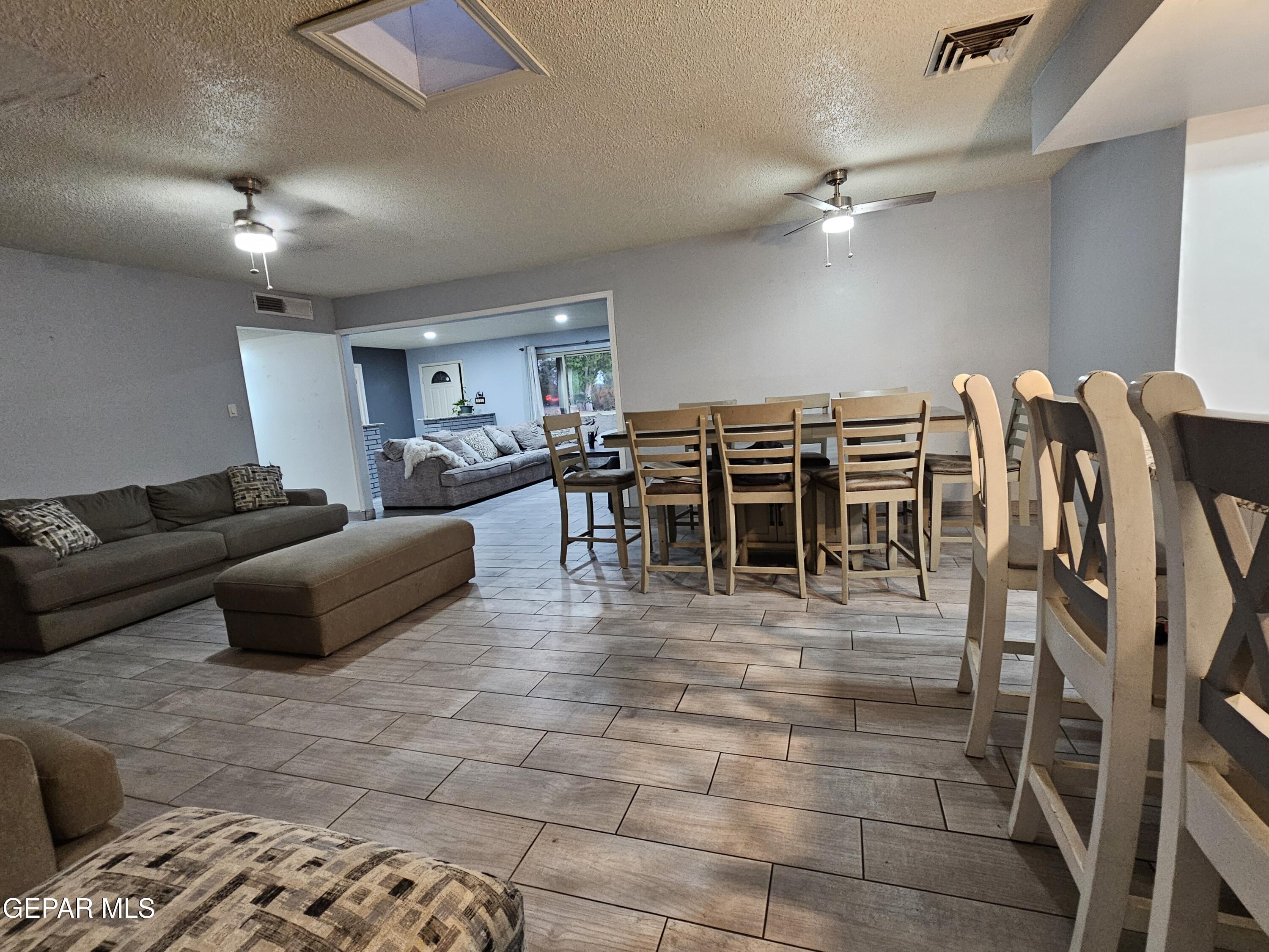 1400 San Andres Drive Las Cruces, NM 88007 - Photo 32 of 47 a living room with furniture and a view of kitchen