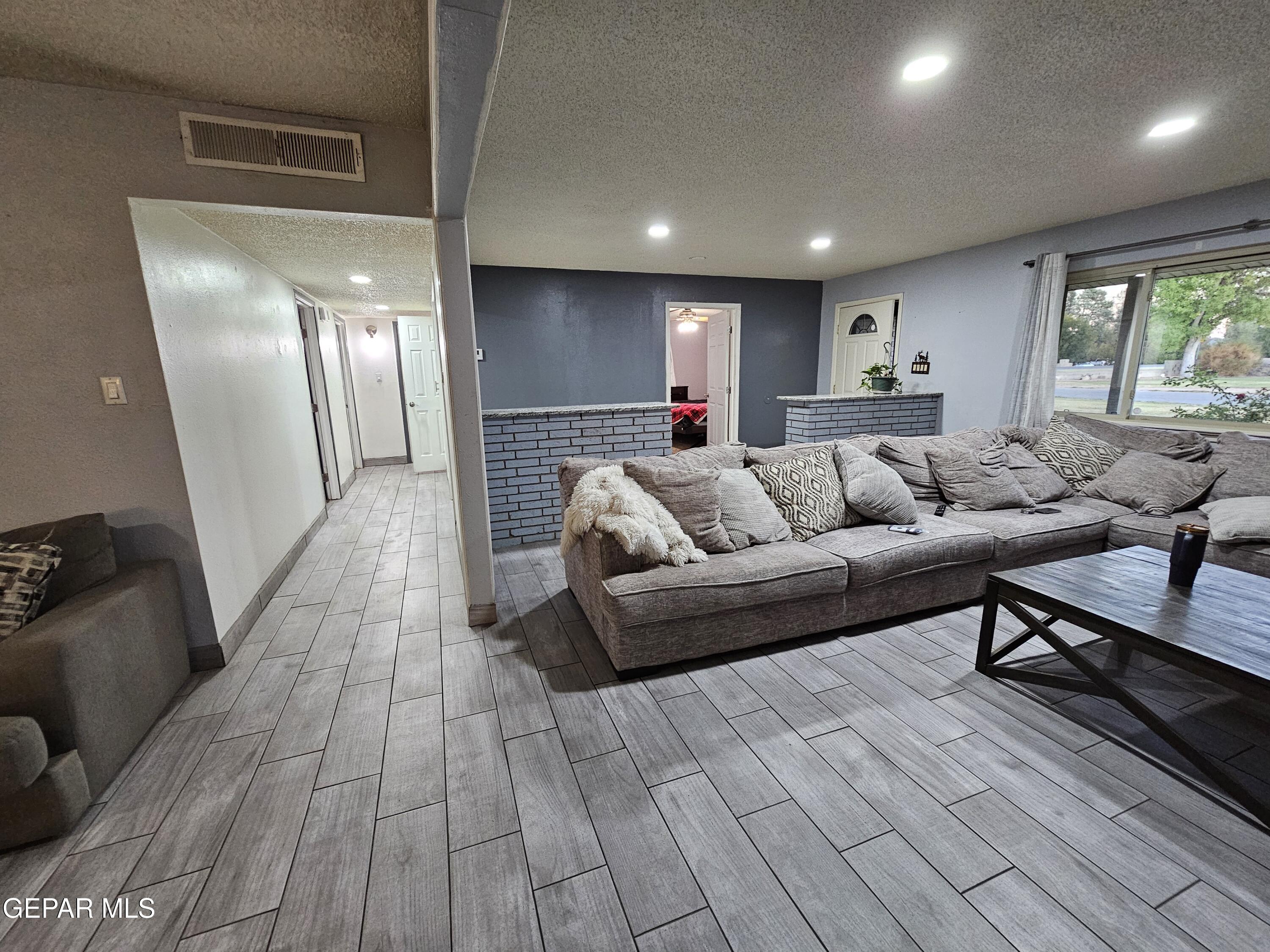 1400 San Andres Drive Las Cruces, NM 88007 - Photo 6 of 47 a living room with furniture and a wooden floor