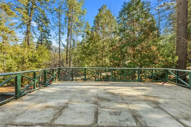 a bathroom with a toilet and a shower curtain