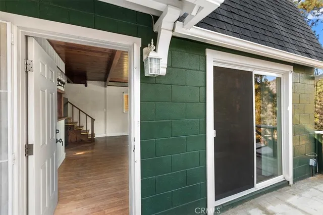a bathroom with a granite countertop shower sink and mirror
