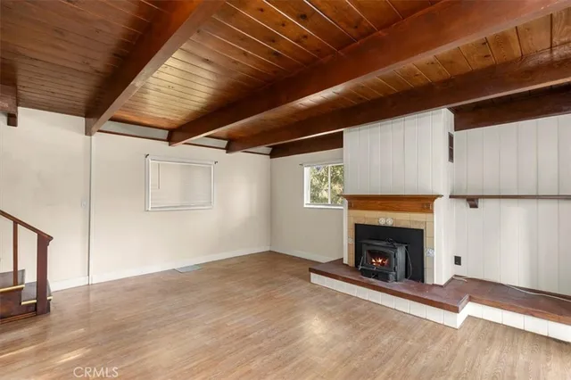a view of entryway with wooden floor and door