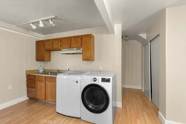 a view of a patio with table and chairs and wooden floor