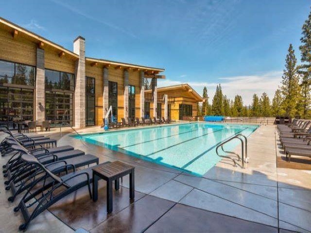 238 Clouds Rest Portola, CA 96122 - Photo 28 of 34 a view of a patio with table and chairs with wooden floor and fence