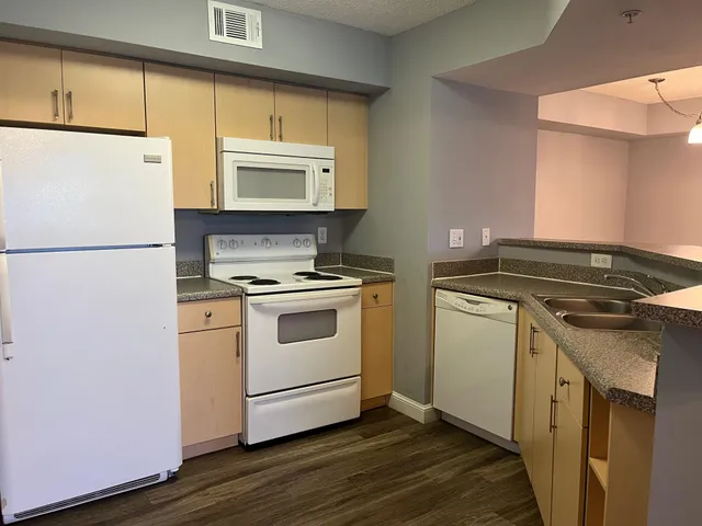a kitchen with a stove and a refrigerator