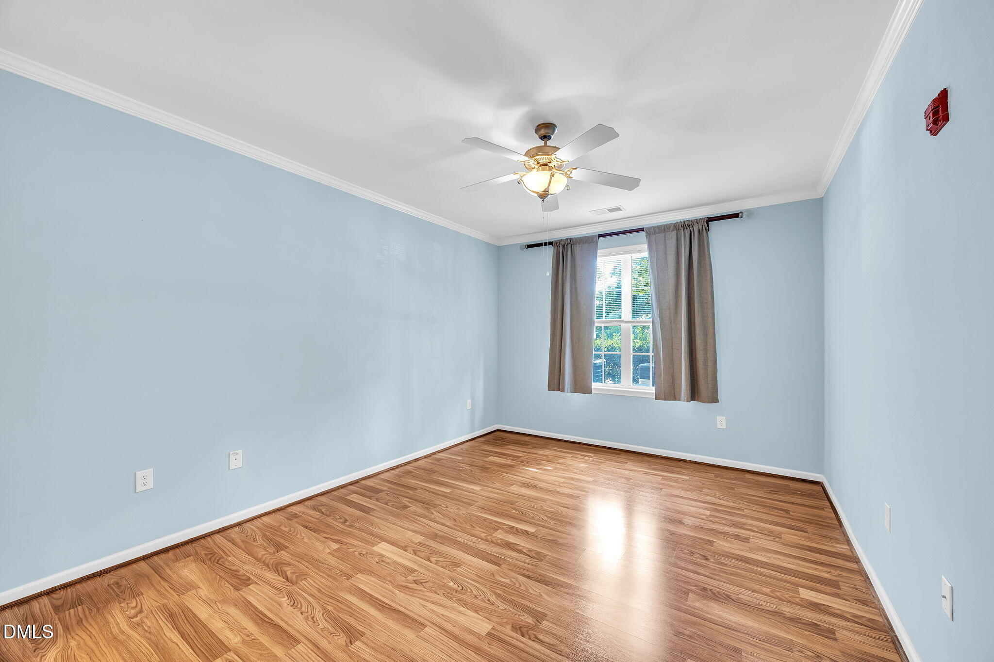 522 Weather Ridge Lane Cary, NC 27513 - Photo 18 of 31 a view of an empty room with a window and wooden floor