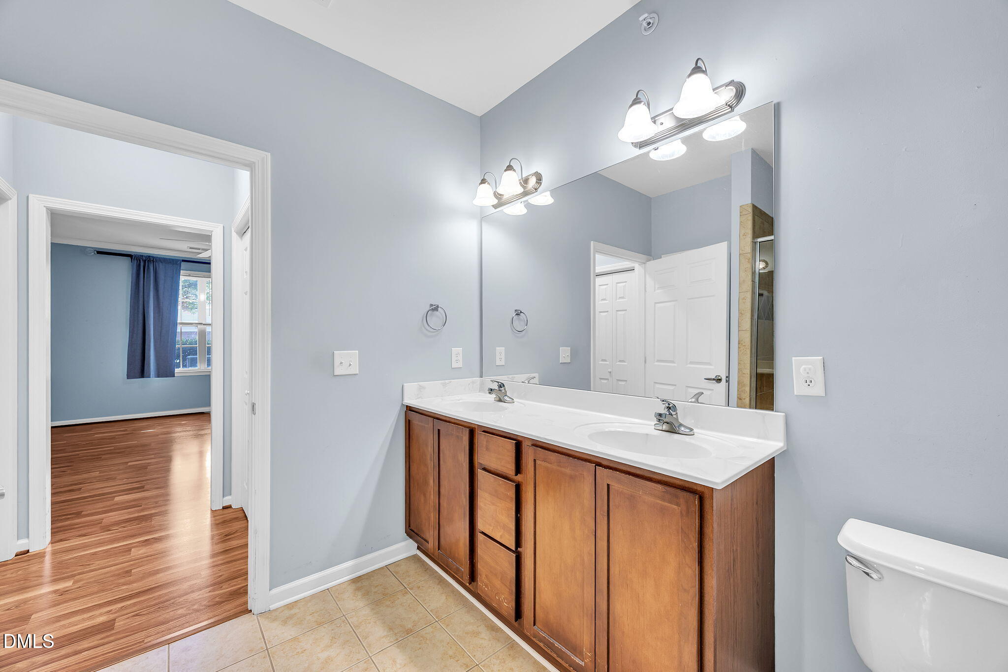 522 Weather Ridge Lane Cary, NC 27513 - Photo 19 of 31 a bathroom with a double vanity sink and a mirror