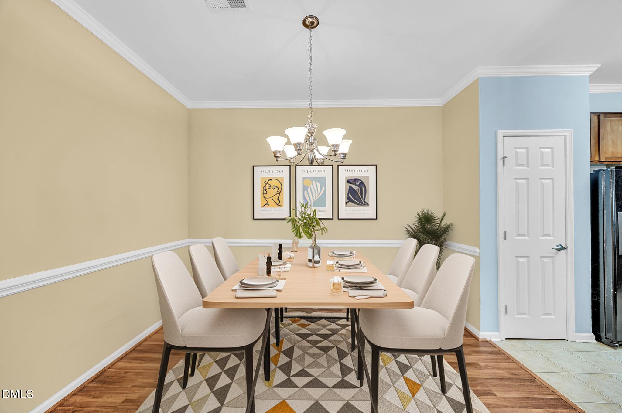 522 Weather Ridge Lane Cary, NC 27513 - Photo 4 of 31 a view of a dining room with furniture and chandelier