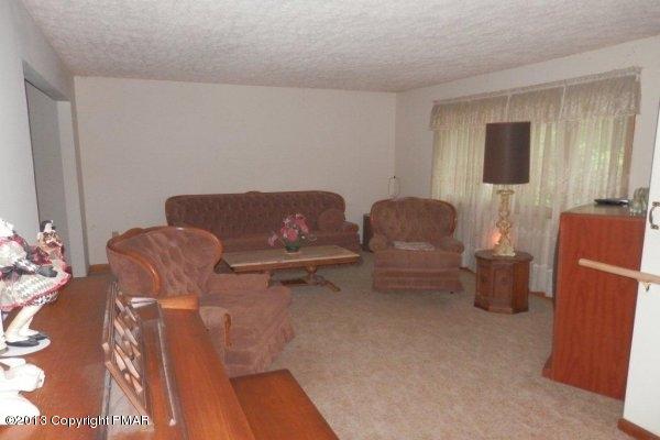 6 Cedar Road Mount Pocono, PA 18344 - Photo 3 of 18 a living room with furniture and a couch