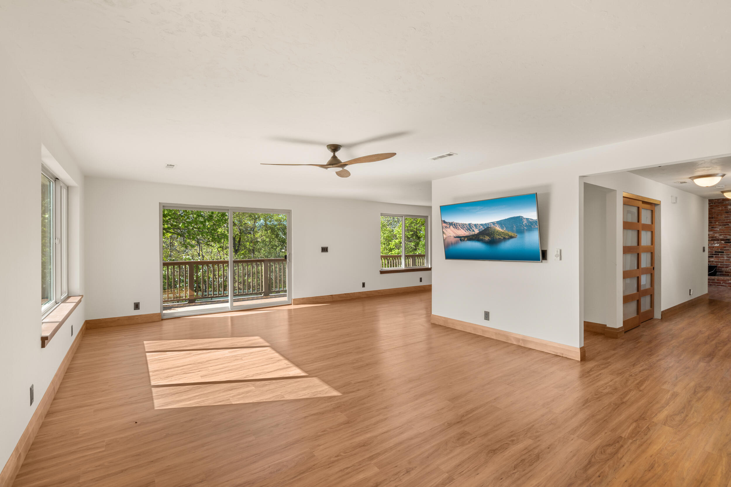 3583 Ross Lane Central Point, OR 97502 - Photo 10 of 52 an empty room with wooden floor and windows