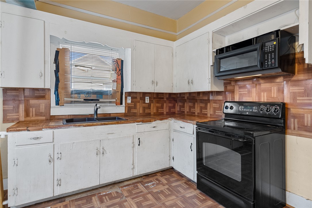 503 Hayes Street Anderson, SC 29624 - Photo 11 of 23 This functional kitchen features a window over the sink and essential cooking appliances.