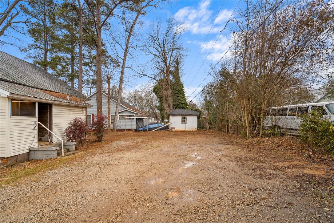 503 Hayes Street Anderson, SC 29624 - Photo 22 of 23 This expansive lot offers ample space, a gravel driveway, and a convenient shed for additional storage.