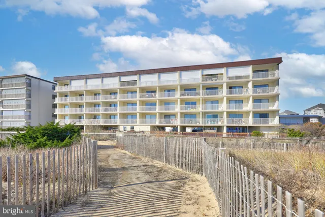 a view of a swimming pool with outdoor seating