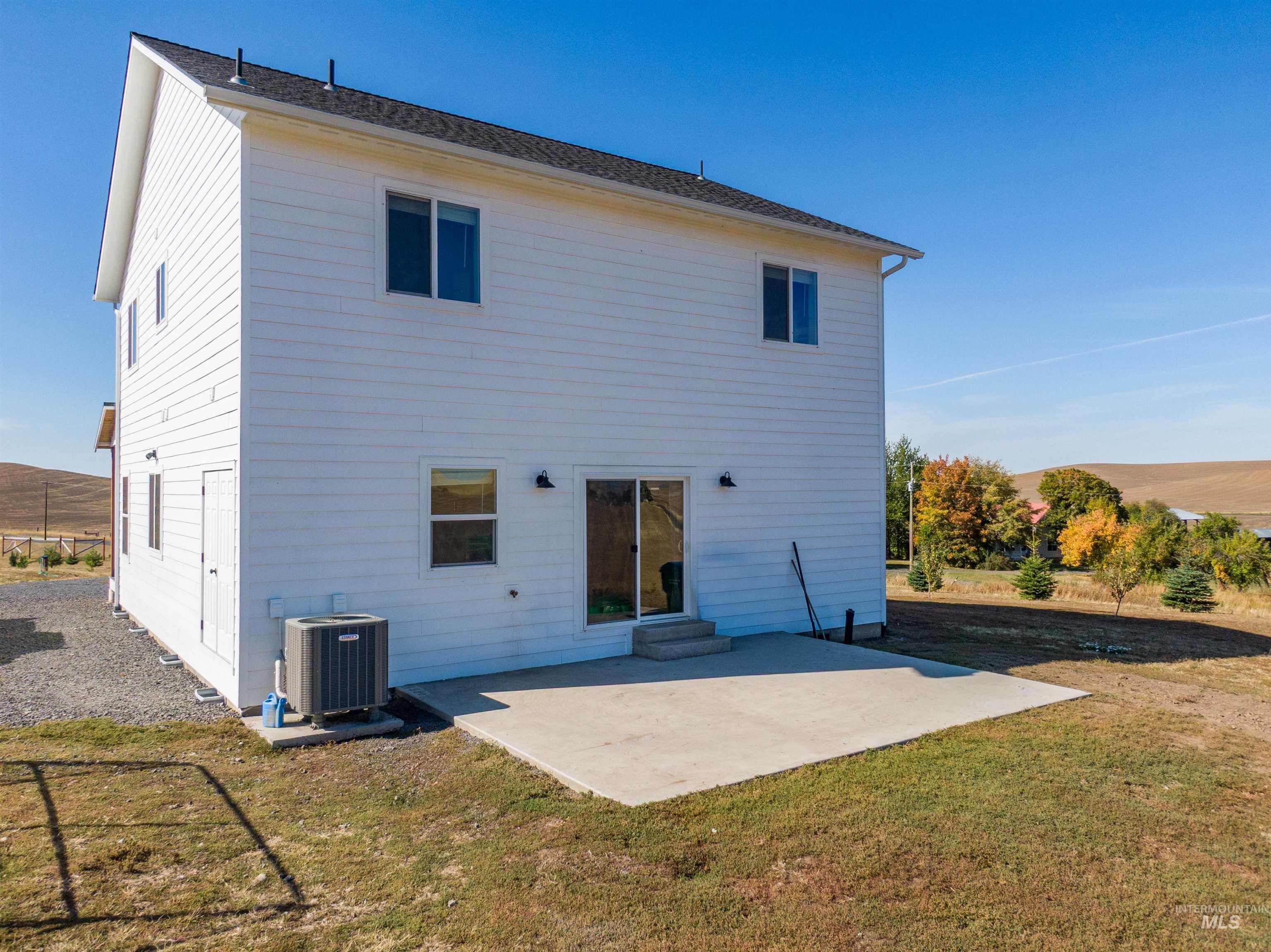 1032 Duffield Flat Road Potlatch, ID 83855 - Photo 44 of 50 White horizontal siding exterior with a dark shingle roof