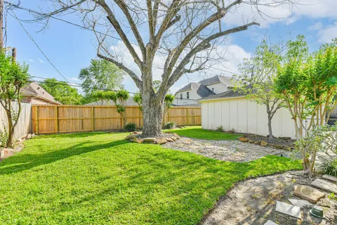 a backyard of a house with lots of green space