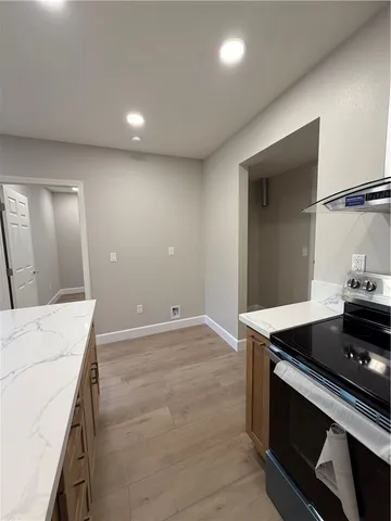 a kitchen that has a sink and a stove in it