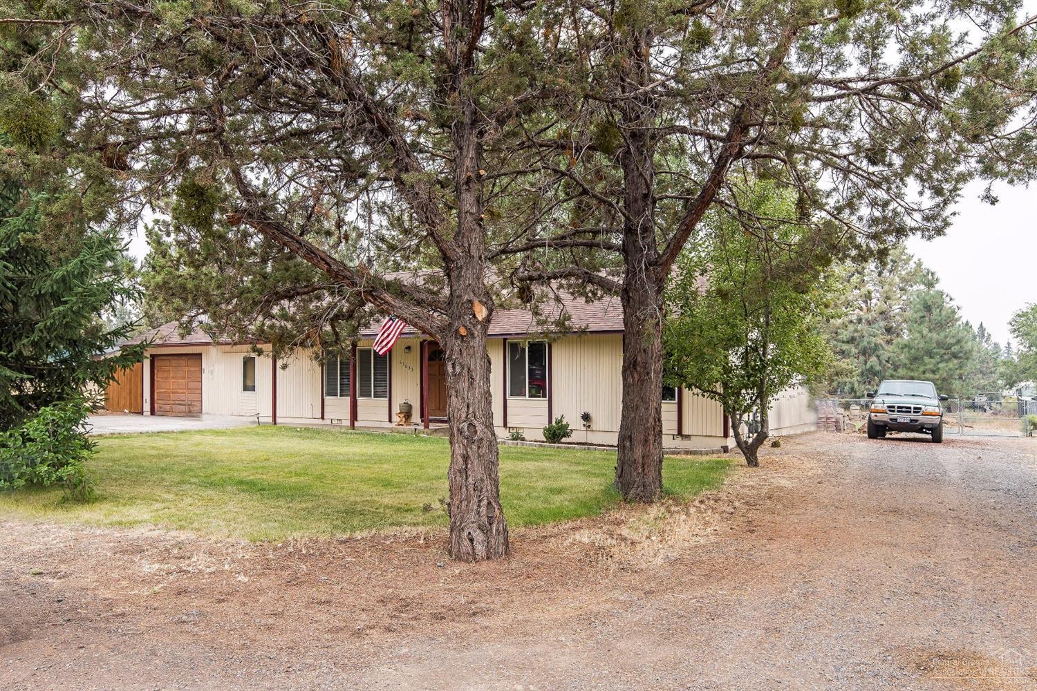 63635 Boyd Acres Road Bend, OR 97701 - Photo 25 of 25 a view of a house with a cars park