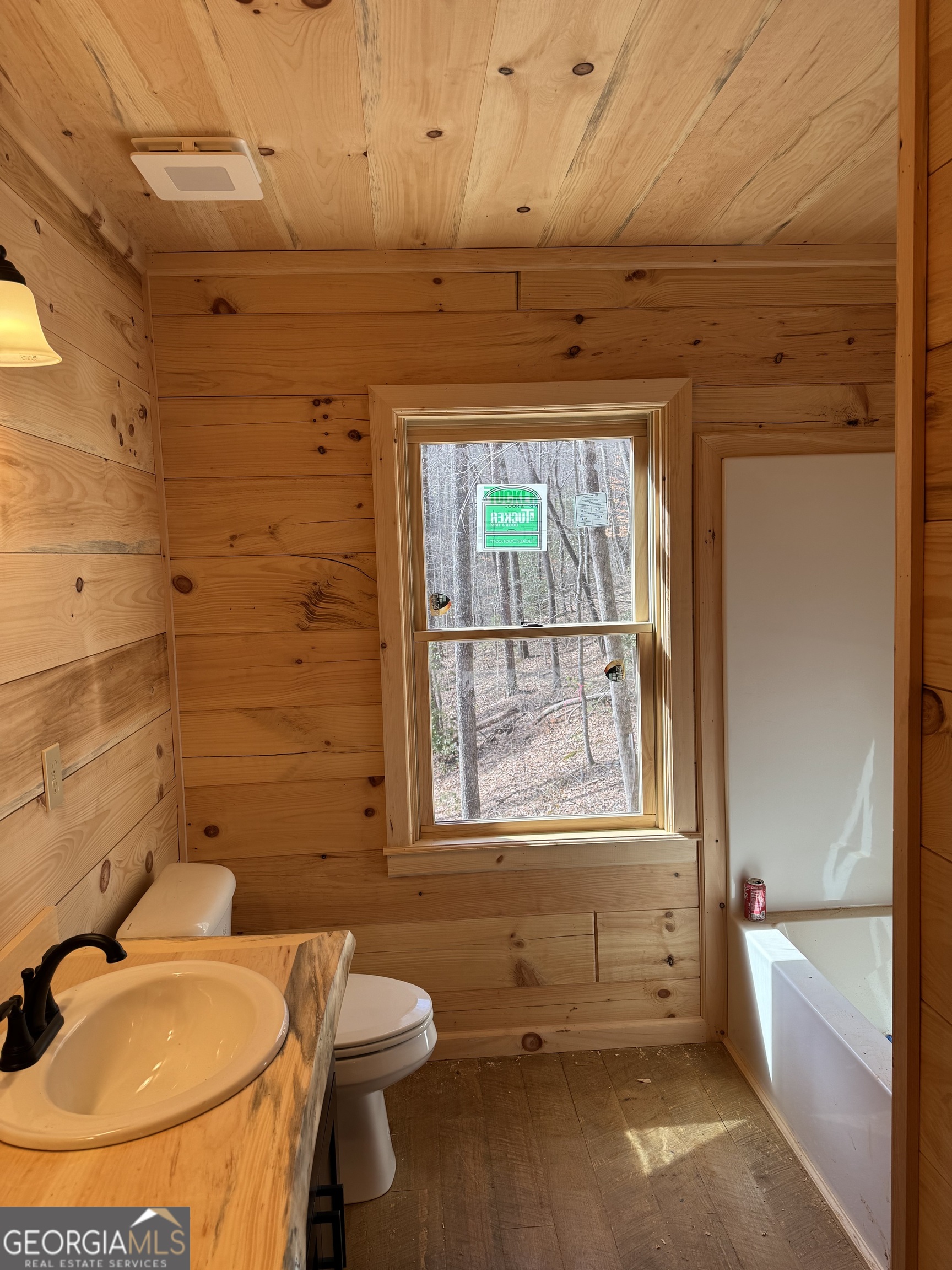 639 Moreland Drive Blue Ridge, GA 30522 - Photo 13 of 24 a bathroom with a sink a toilet and shower