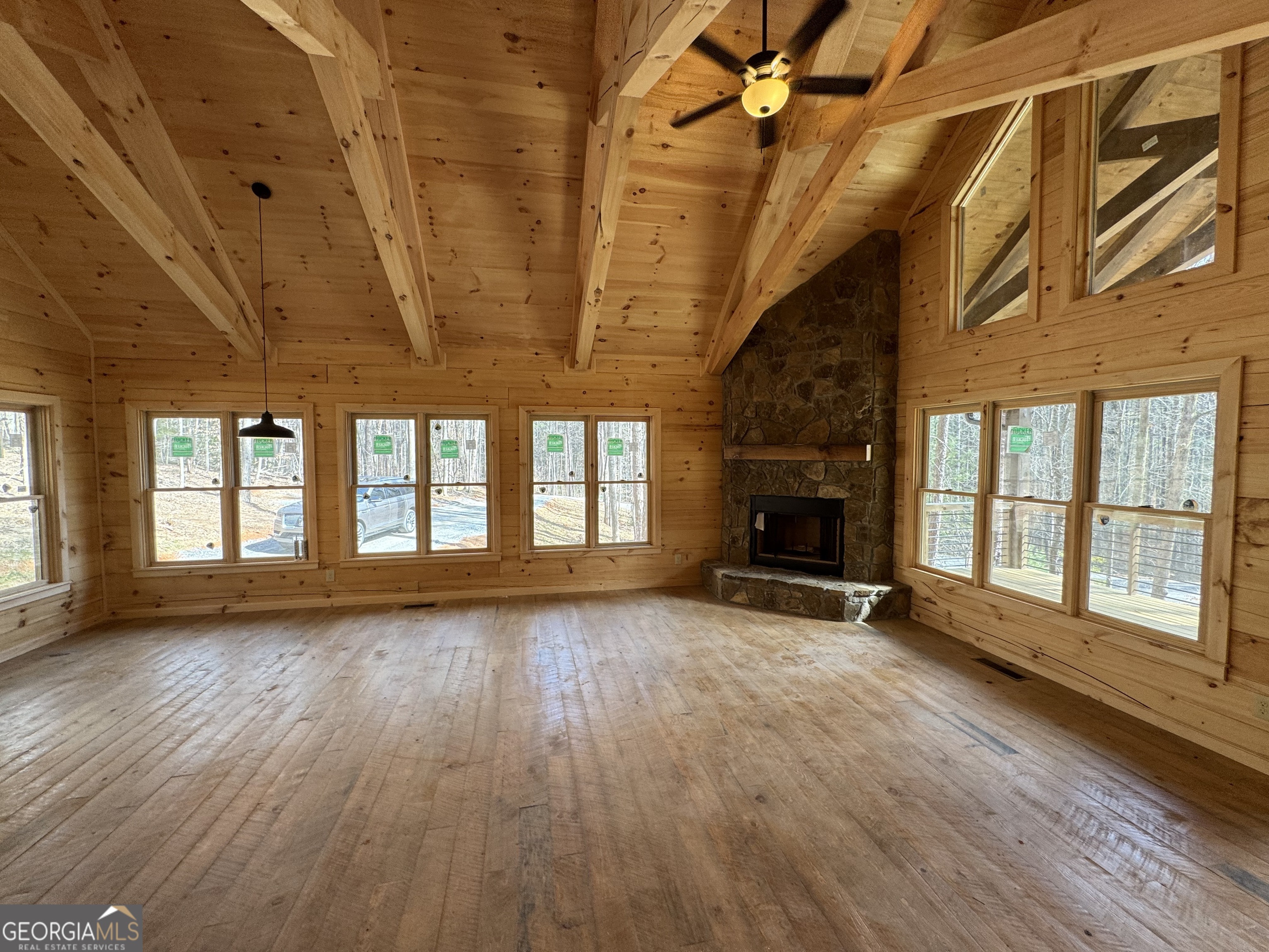 639 Moreland Drive Blue Ridge, GA 30522 - Photo 21 of 24 a view of an empty room with wooden floor and a window