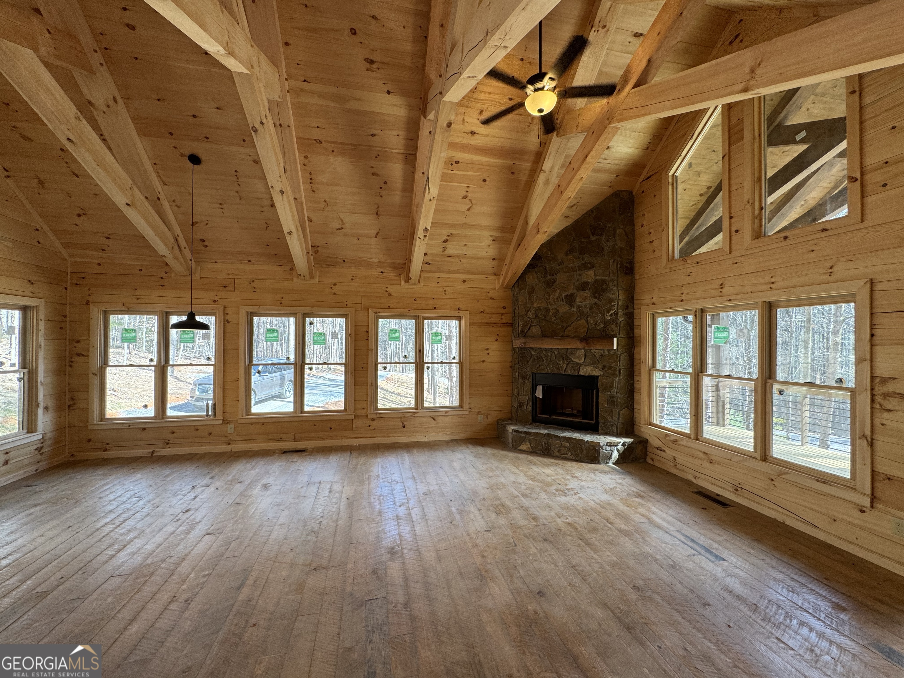 639 Moreland Drive Blue Ridge, GA 30522 - Photo 22 of 24 a view of an empty room with wooden floor and a window