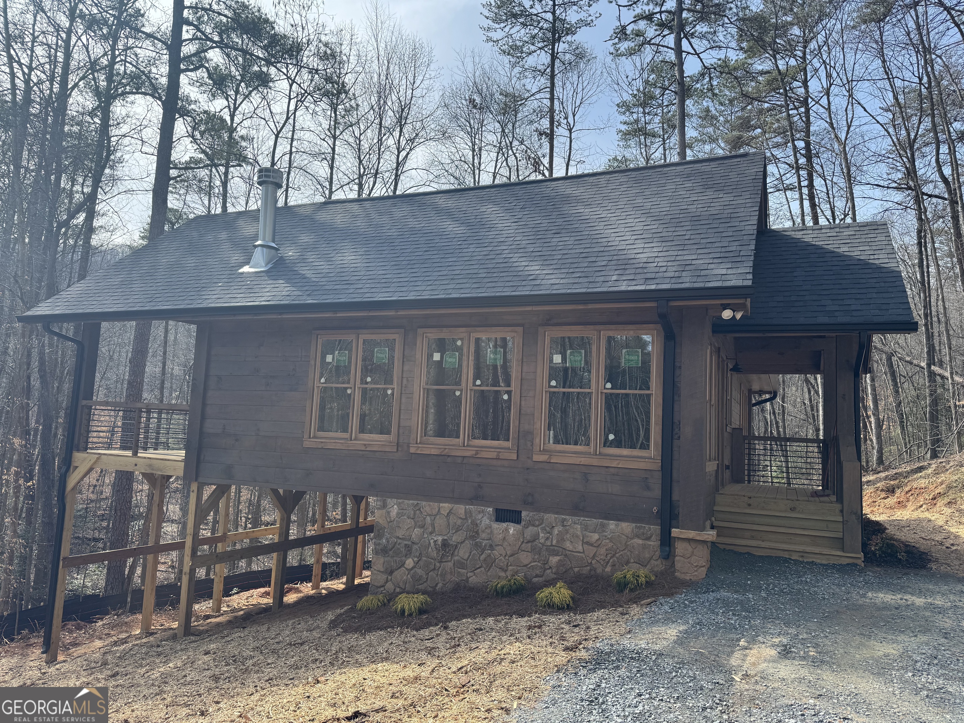 639 Moreland Drive Blue Ridge, GA 30522 - Photo 3 of 24 a front view of a house with garden