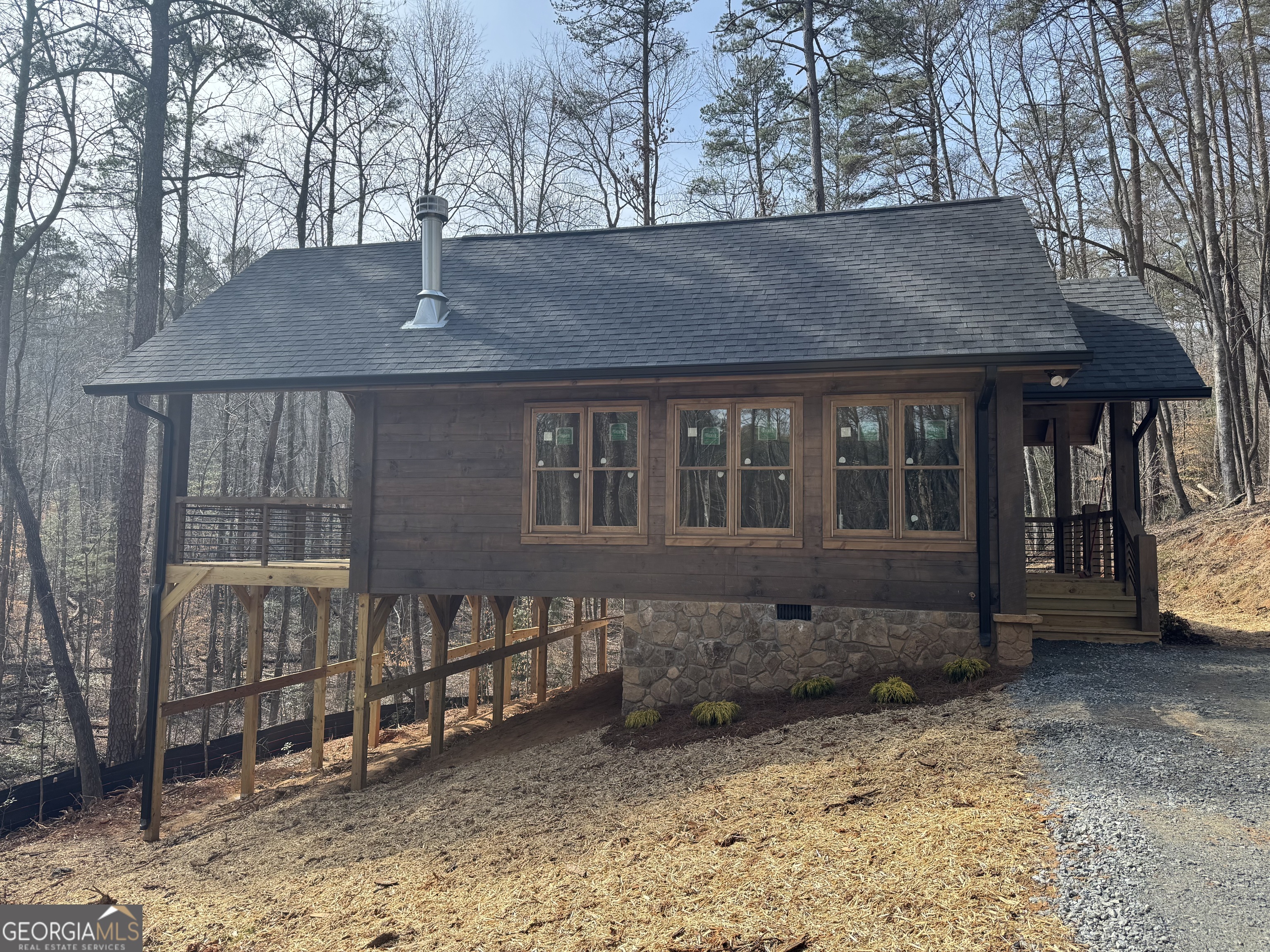 639 Moreland Drive Blue Ridge, GA 30522 - Photo 4 of 24 a front view of a house with a garden