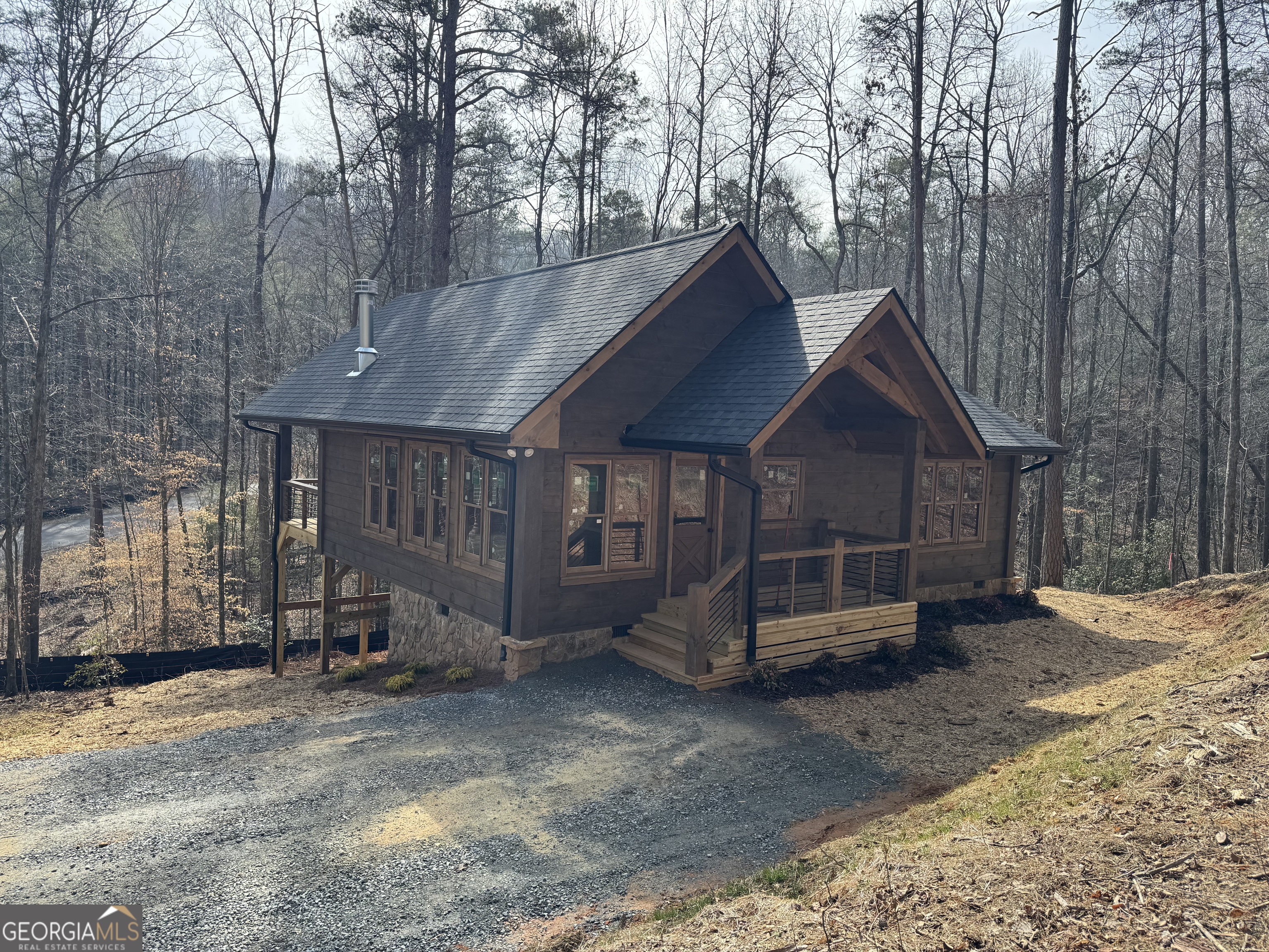 639 Moreland Drive Blue Ridge, GA 30522 - Photo 7 of 24 a view of a house with a yard and wooden fence