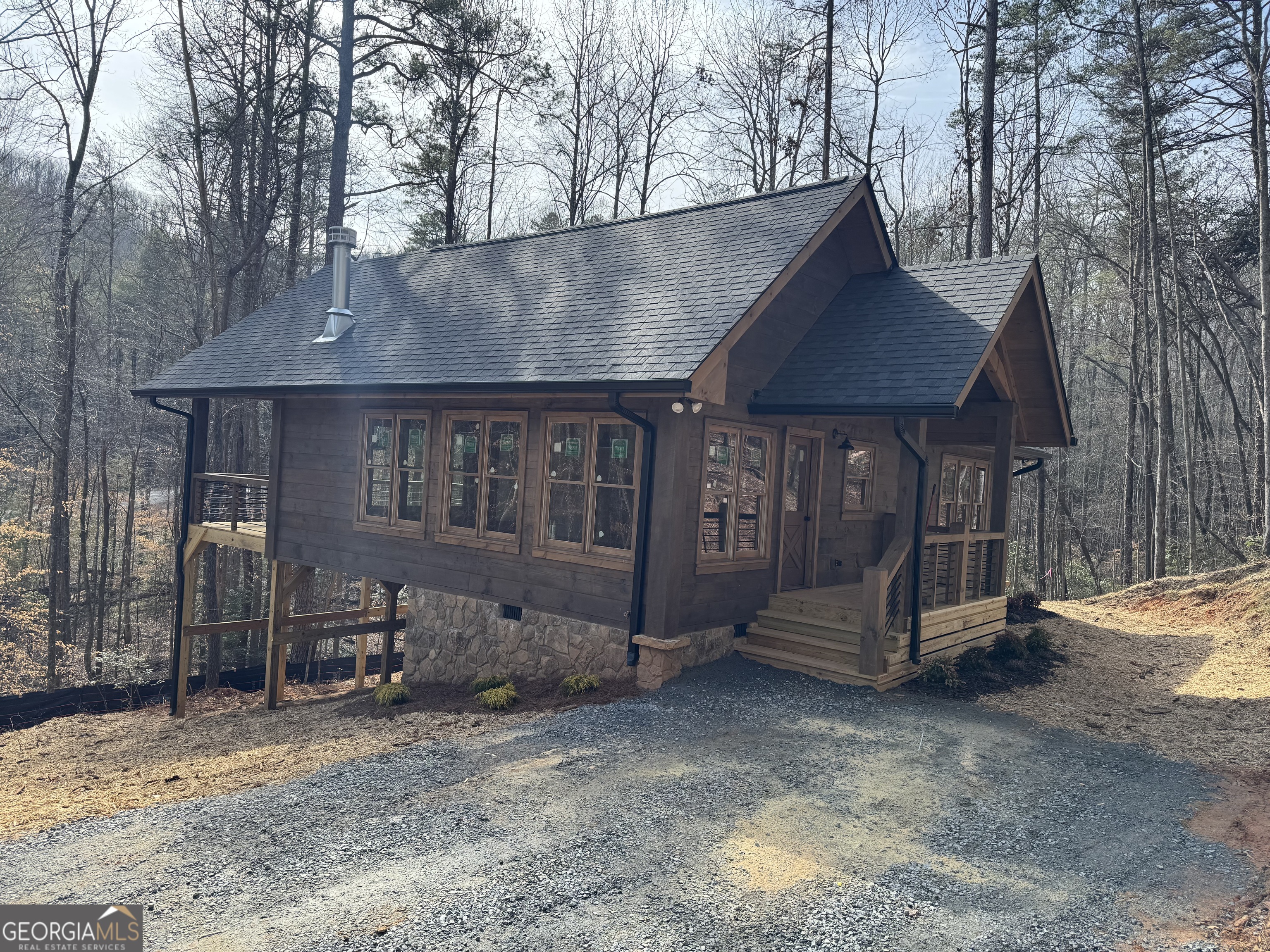 639 Moreland Drive Blue Ridge, GA 30522 - Photo 8 of 24 a view of a house with a yard and wooden fence