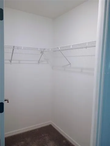 a view of an empty walk in closet