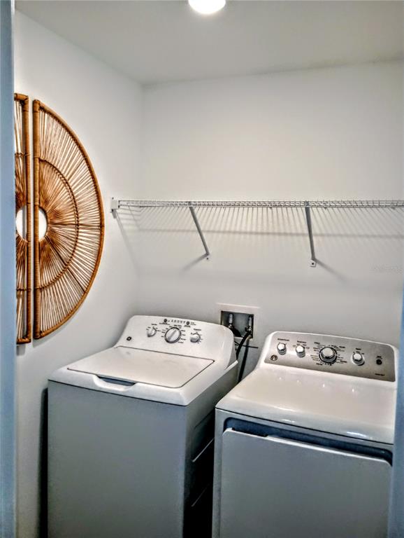 21415 Darter Road Land O' Lakes, FL 34638 - Photo 16 of 27 a utility room with dryer and washer
