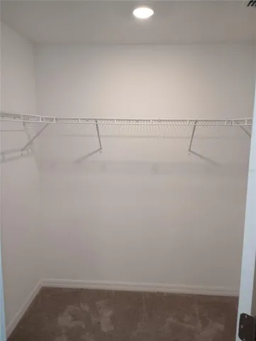 a view of room with stairs and a window