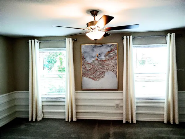 a view of room with stairs and a window