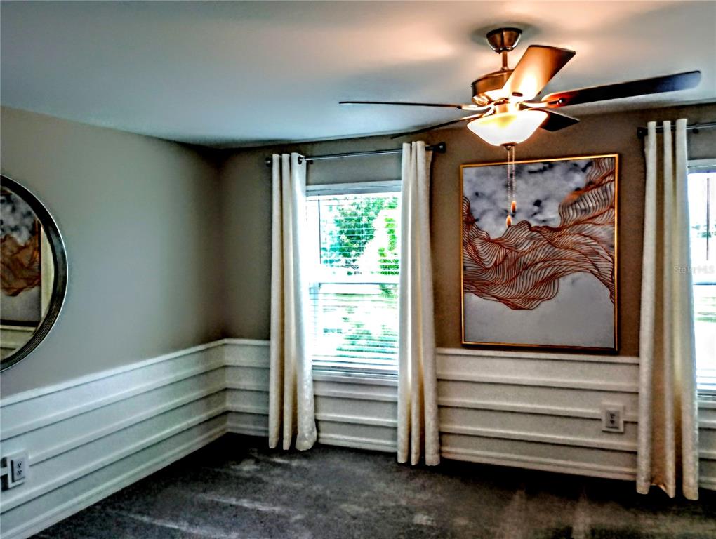 21415 Darter Road Land O' Lakes, FL 34638 - Photo 21 of 27 a view of room with stairs and a window