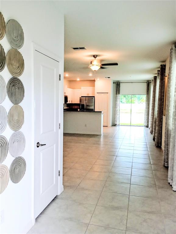 21415 Darter Road Land O' Lakes, FL 34638 - Photo 3 of 27 a view of a hallway with entryway and furniture