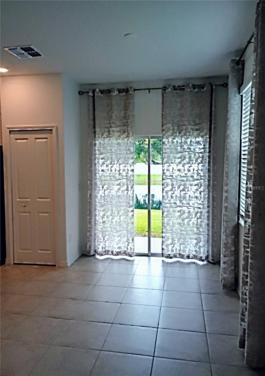 21415 Darter Road Land O' Lakes, FL 34638 - Photo 7 of 27 a view of a room with window and front door