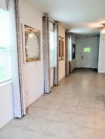 an empty room with closet and mirror