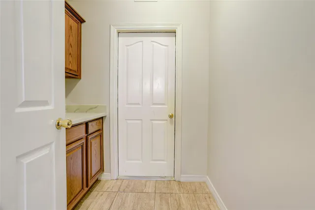 a view of front door with wooden floor