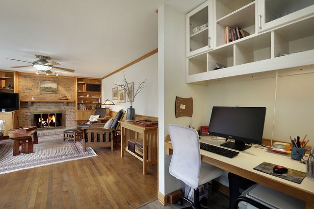 a workspace with furniture hardwood and a living room