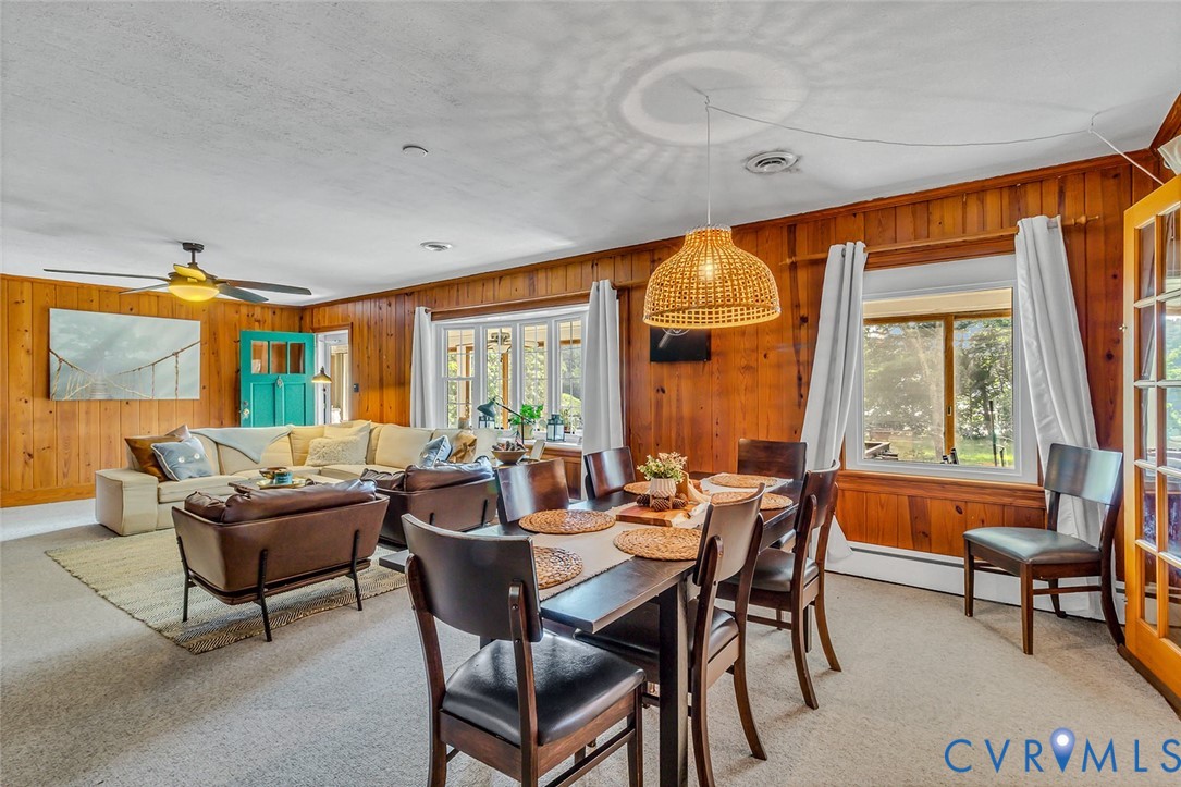 437 Plainview Road Kinsale, VA 22488 - Photo 18 of 50 a dining room with furniture and a floor to ceiling window